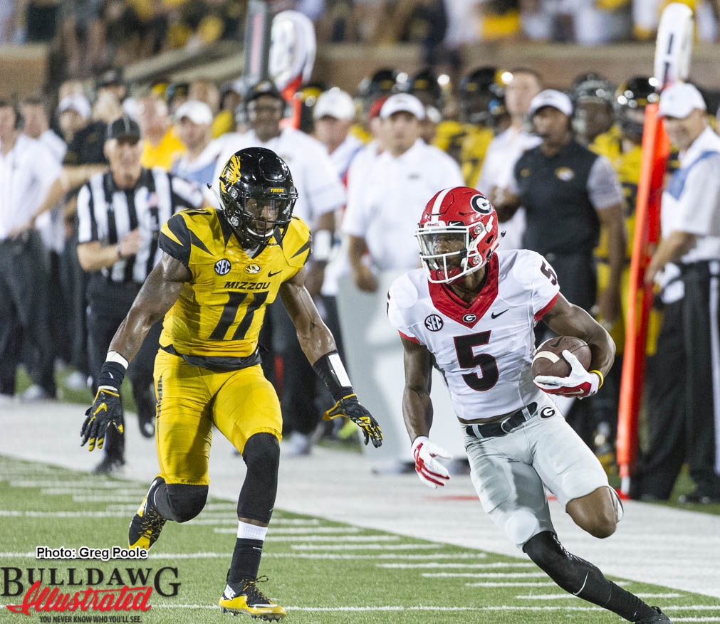 Terry Godwin (5) looking for more yards after the catch