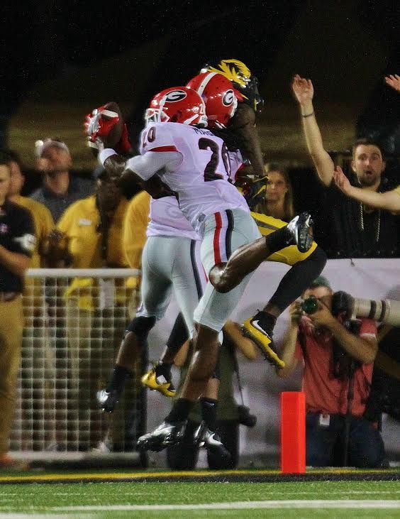 Quincy Mauger snatches his second interception of the game (Photo by Rob Saye)