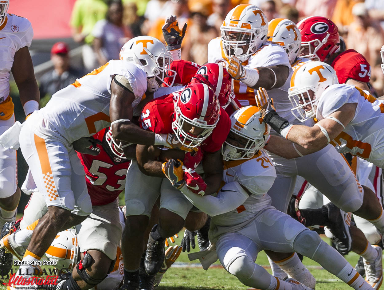 Brian Herrien appears to drag the entire Tennessee defense