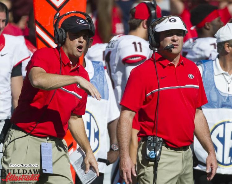 Kirby Smart (on right) looks on as his team battles South Carolina on Sunday afternoon on the way to a 28-14 Bulldog win
