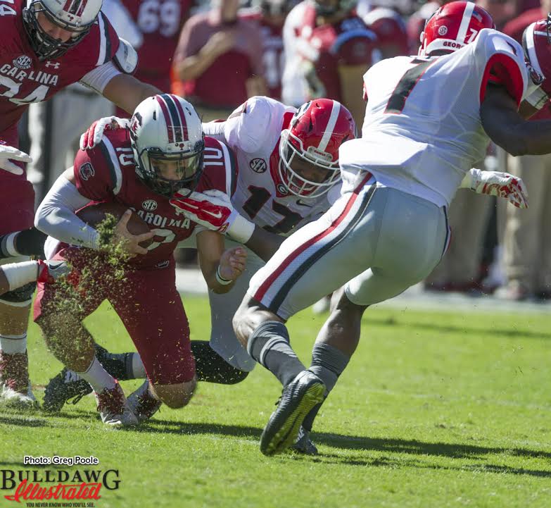 Davin Bellamy (17) drags down SC QB Perry Orth (10) for a sack