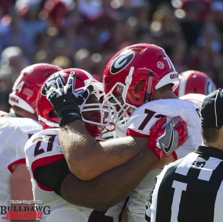Nick Chubb (27) and Tyler Catalina (72) celebrate one of his two rushing TDs