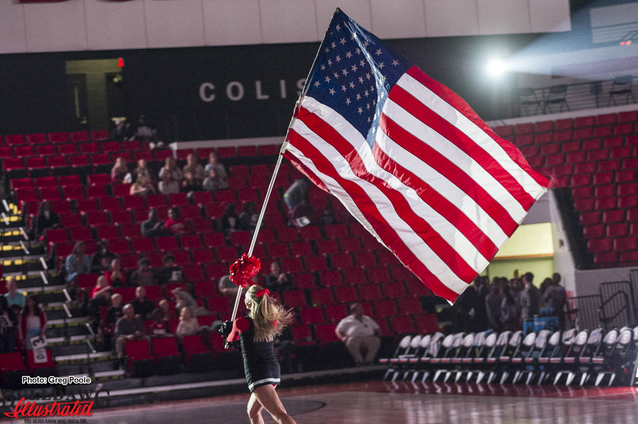 Georgia cheerleaders display the American flag Stegeman Coliseum on Veterans Day