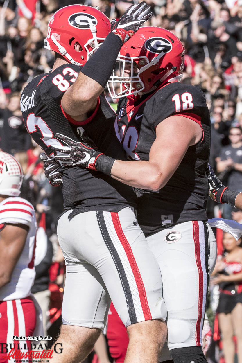 Tight ends Jeb Blazevich (83) and Isaac Nauta (18) celebrate a TD