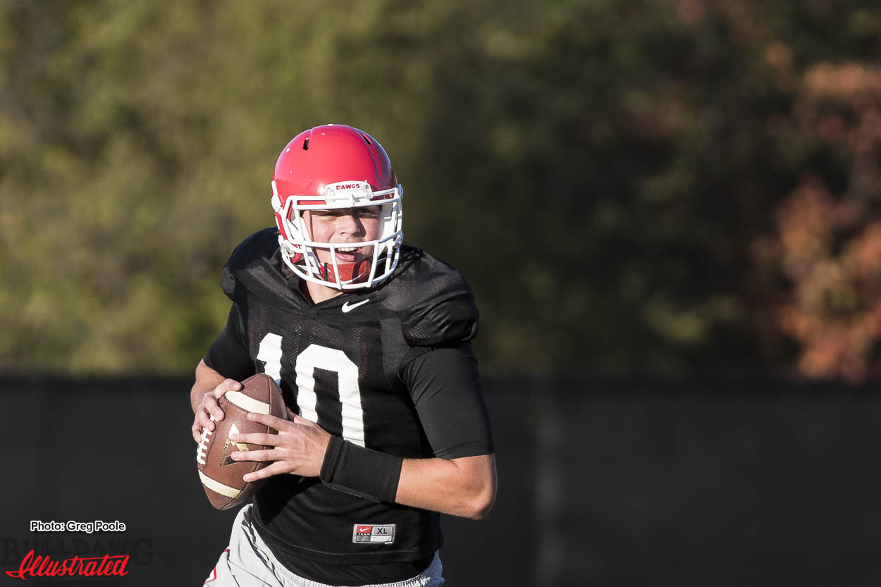 Jacob Eason(10) running through a practice drill during practice on Monday November 21, 2016.