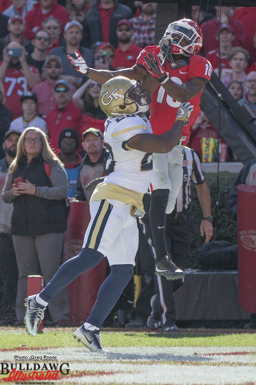 Isaiah McKenzie (16) outjumps the GT defender but is interferred with