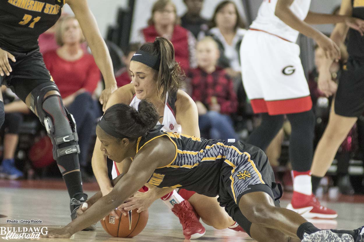 Simone Costa (24) fights for a loose ball during the game against Kennesaw State.