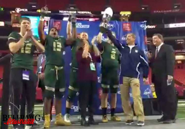 Grayson Rams football team is presented with the 2016 GHSA Class 7A Football State Championship trophy (photo by Bob Miller/Bulldawg Illustrated)