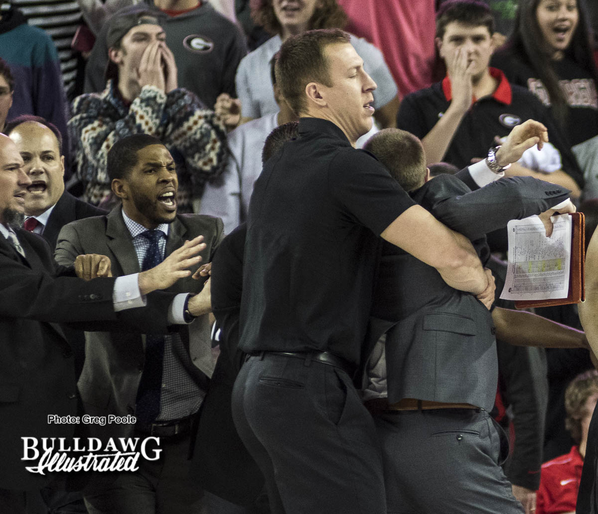 A Missouri assistant coach is restrained during the scuffle at the end of the first half of the UGA/Missouri game January 7, 2017