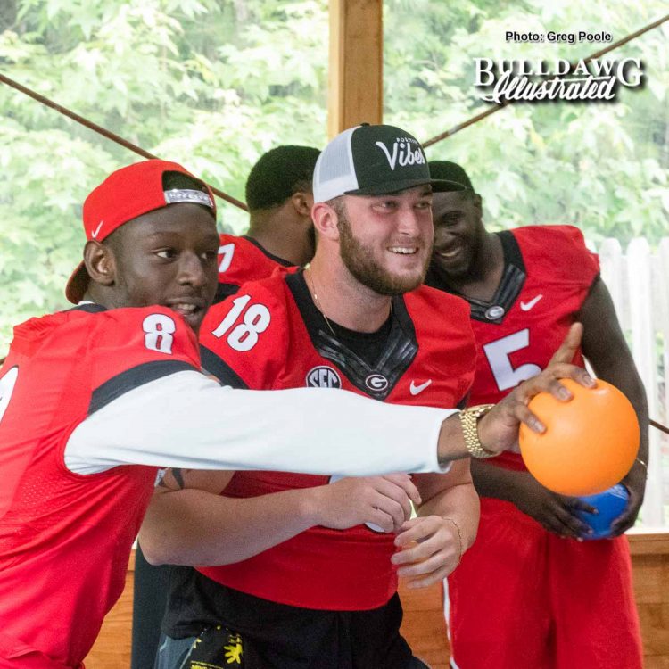 Riley Ridley (8) and Isaac Nauta (18) plot strategy during the dodgeball match a Camp Sunshine June 21, 2017