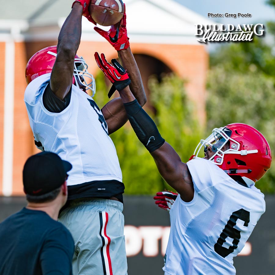 Riley Ridley (8) makes the catch over Javon Wims (6) in Monday's receiving drills - Sept. 4, 2017 -