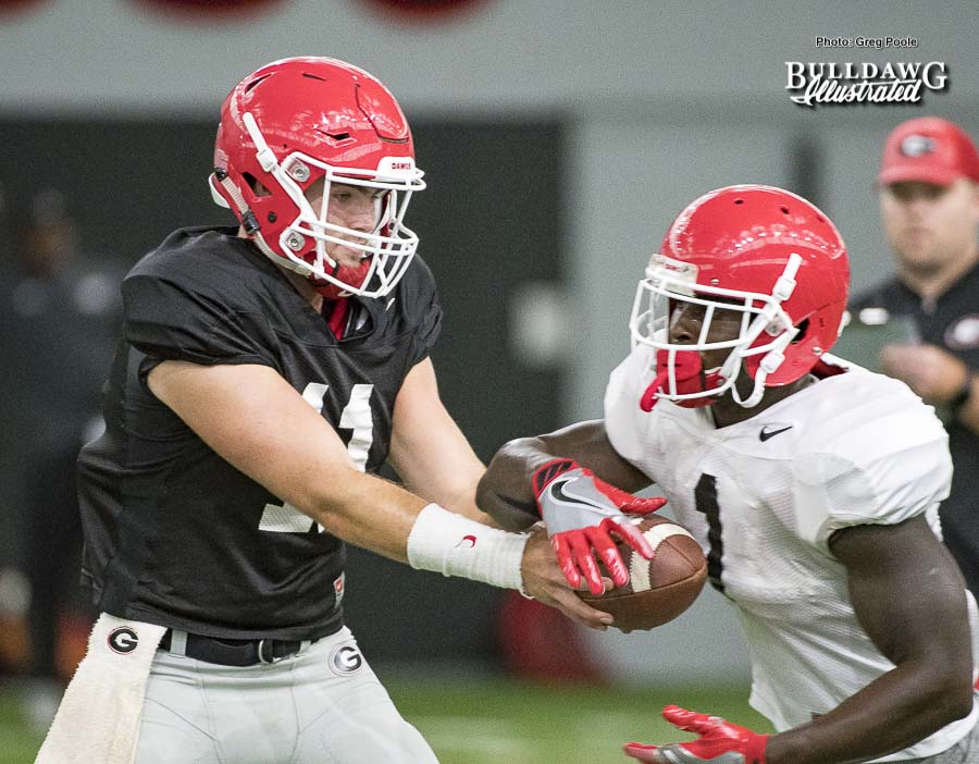 Jake Fromm (11) hands the ball off to Sony Michel (1) - UGA football practice - Wednesday, Sept. 6, 2017