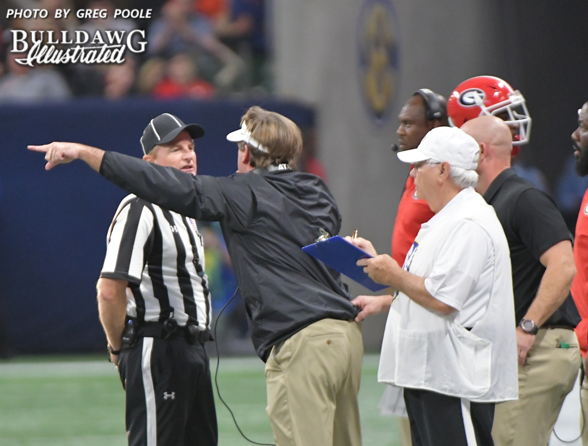 Kirby Smart makes his case to an official after Georgia is flagged for a penalty during the SEC Championship game on Saturday, Dec. 2, 2017.