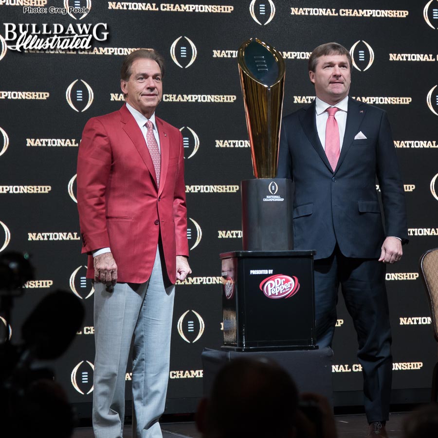 Alabama Head Coach Nick Saban and Georgia Head Coach Kirby Smart pose with the College Football Playoff National Championship trophy after Sunday morning's press conference, Jan. 7, 2018.