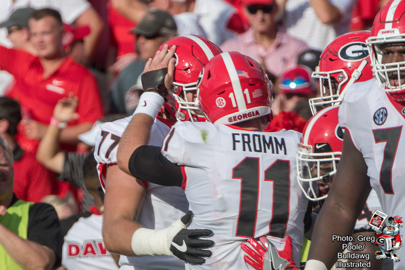 Jake Fromm (11) celebrates with Cade Mays (77) - Georgia vs. South Carolina 2018