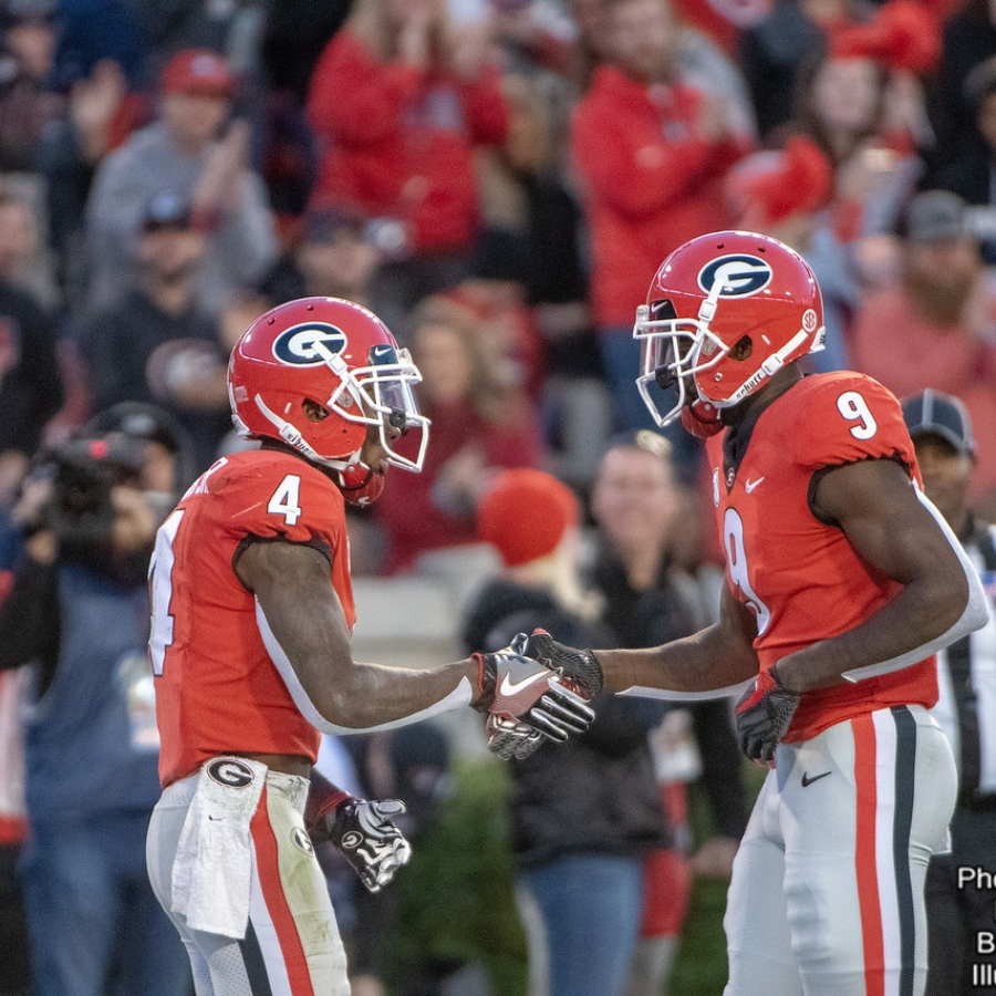 Mecole Hardman (4) and Jeremiah Holloman (9)