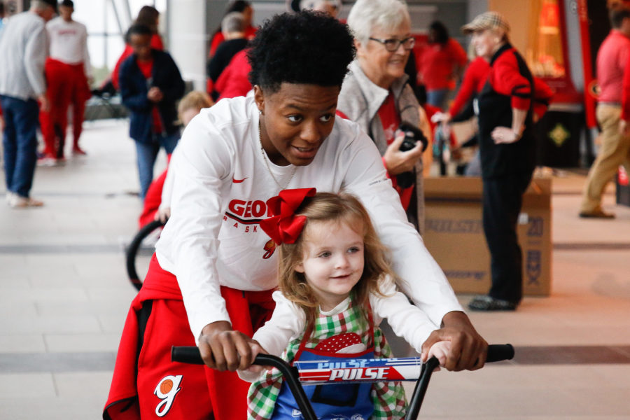 Georgia women's basketball players help assemble bikes in Stegeman Coliseum in Athens, Ga., on Saturday, Dec. 8, 2018. (Photo courtesy of Kristin Bradshaw, UGA Sports Communications)