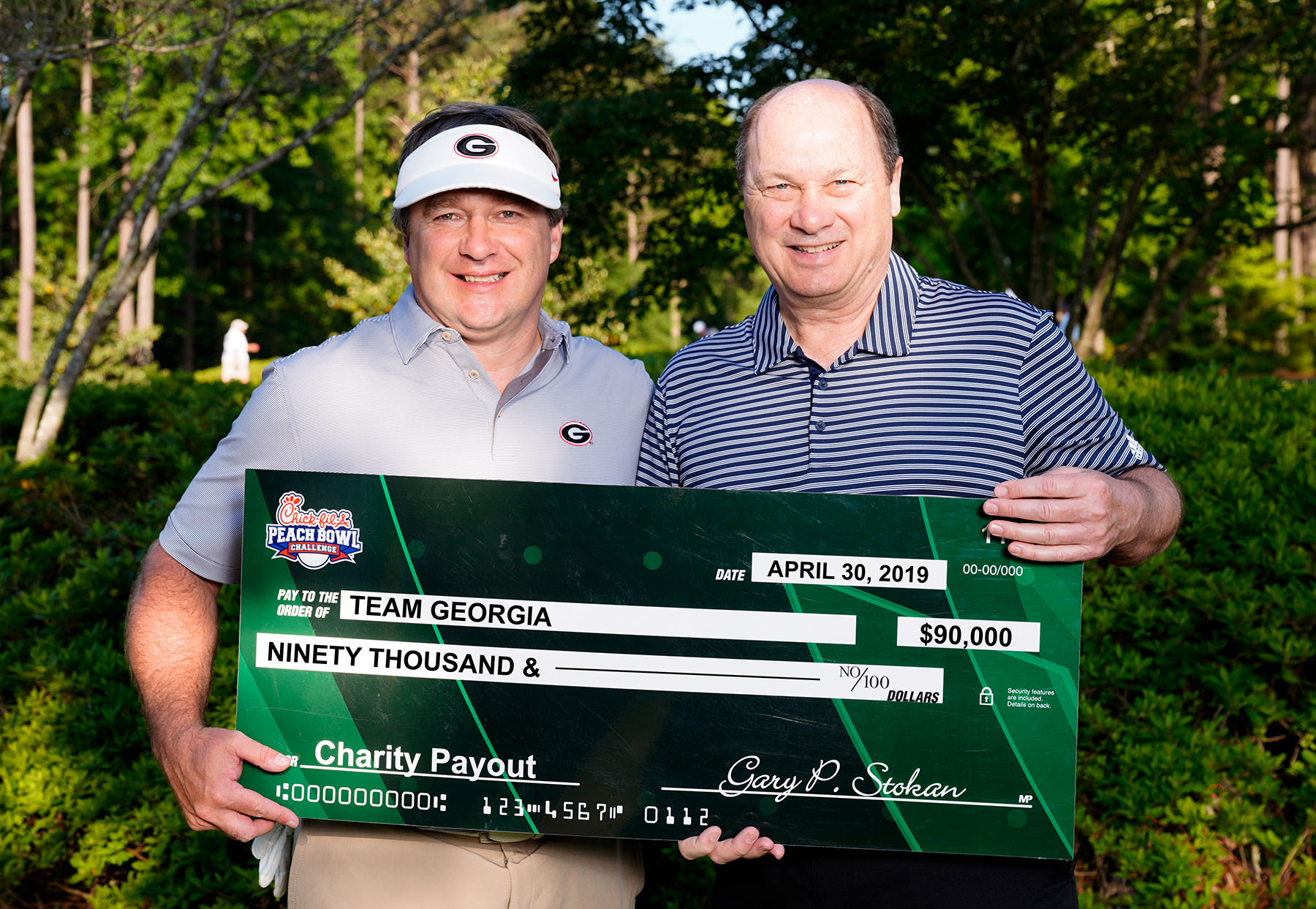 Kirby Smart Presented with check from Chick-fil-A Peach Bowl Challenge  (Photo: Georgia Sports Communications)
