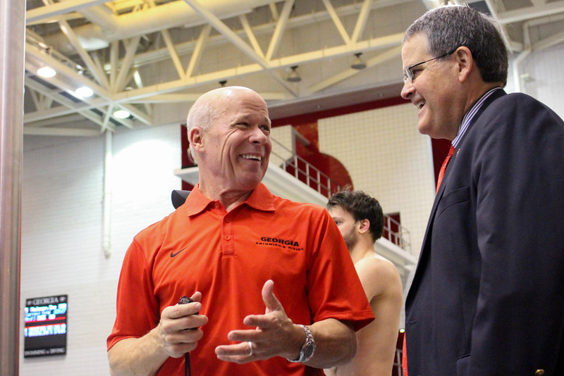 University of Georgia President Jere W. Morehead talks with Georgia head coah Jack Baurele during a meet between Georgia and Wisconsin on Saturday, Jan. 30, 2016, in Athens, Ga. (Photo by Emily Selby )