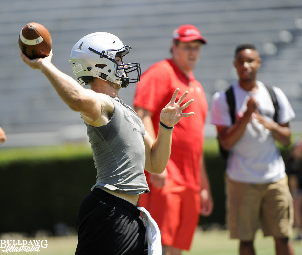 Jake Fromm throws as Sam Madden looks on
